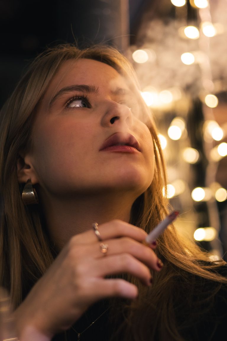 Nighttime portrait with city lights